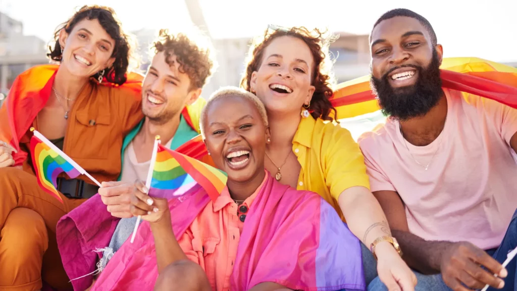 Group of 2slgbtqia+ Tourism & Hospitality workers celebrating at Pride in Vancouver.